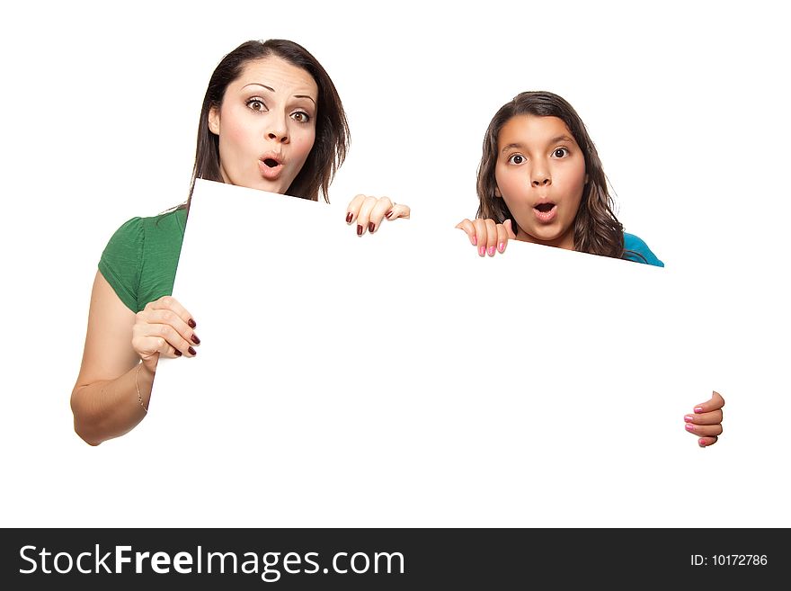 Pretty Hispanic Girl and Mother Holding Blank Board Isolated on a White Background.