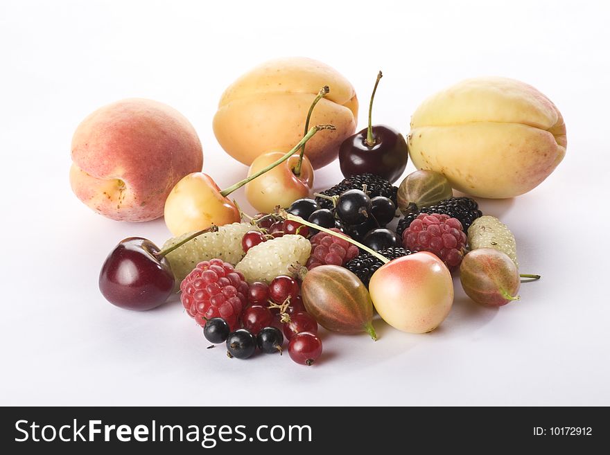 Raspberries, red currant, black currant, black mulberries, white mulberries, apricots, cherries and gooseberry on a white background. Raspberries, red currant, black currant, black mulberries, white mulberries, apricots, cherries and gooseberry on a white background.