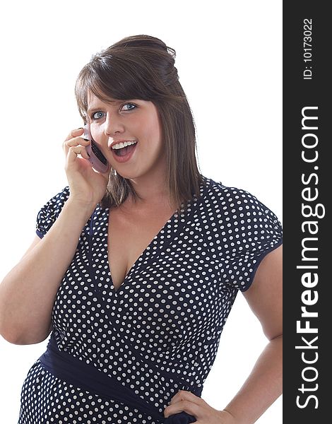 Young happy woman in business attire talking on her cell phone; isolated on a white background. Young happy woman in business attire talking on her cell phone; isolated on a white background.