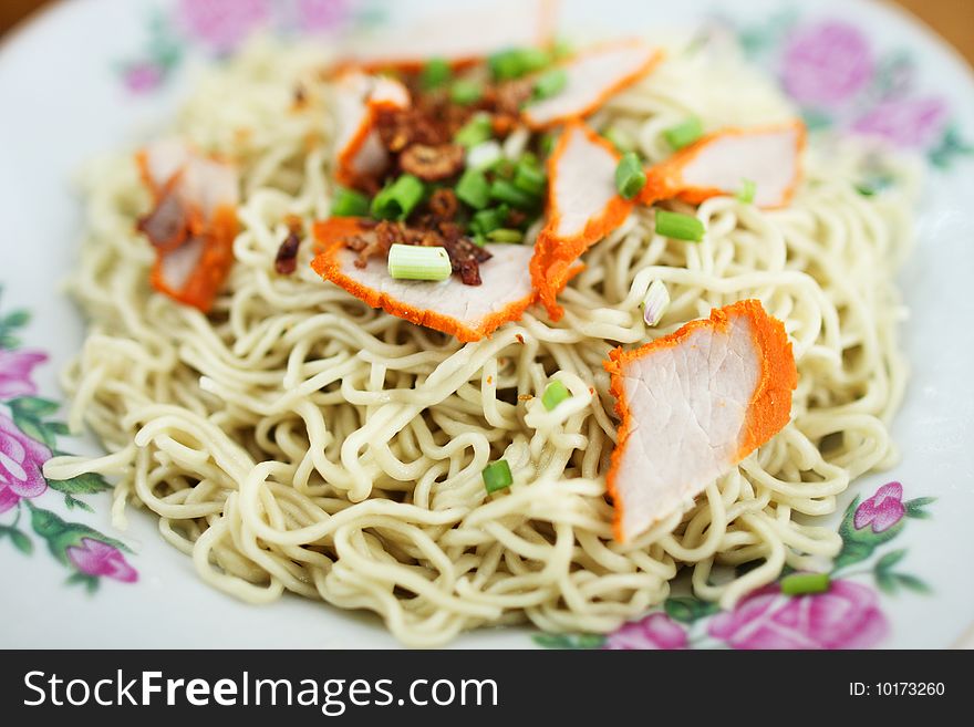 Closeup of Kampua mee (Sarawak Chinese noodles) with roasted pork meat.