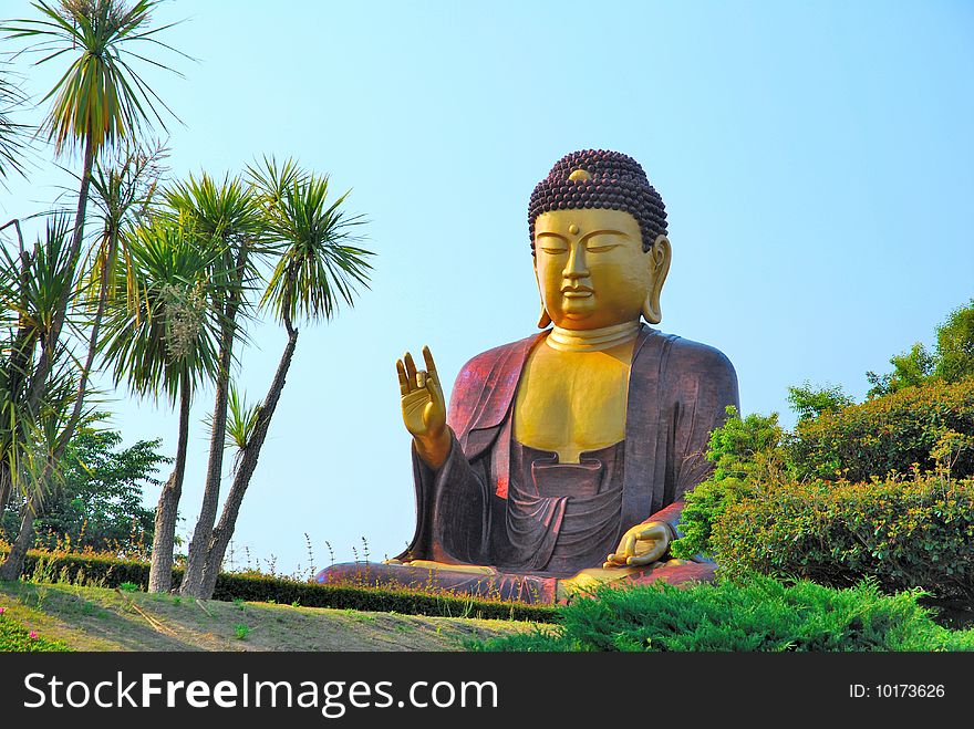 Huge buddha statue surrounded with nature