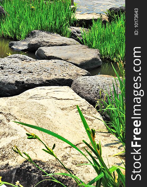 Path across a river paved with huge rocks. Path across a river paved with huge rocks