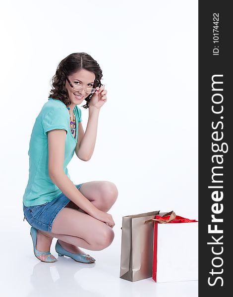 Young woman with shopping bag in different actions and emotions. Young woman with shopping bag in different actions and emotions