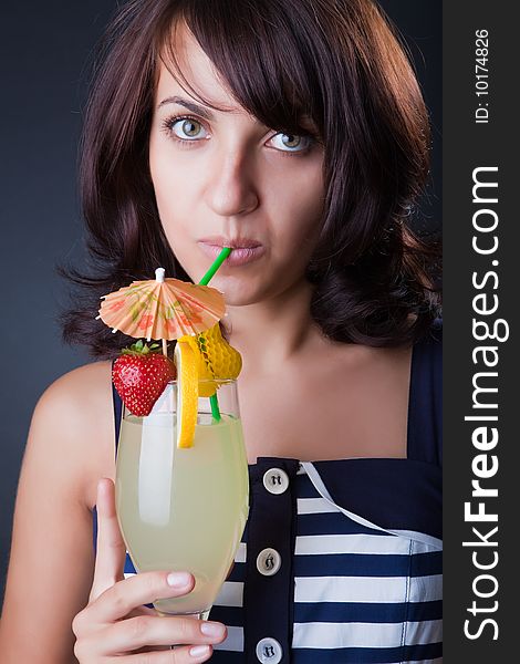 Beautiful girl with a fruit cocktail