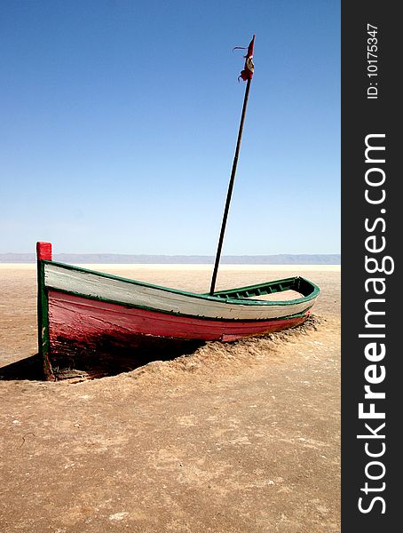 Boat on salt lake in tunisia called chott el jerid