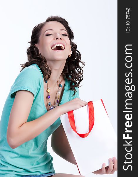 Young woman with shopping bag in different actions and emotions. Young woman with shopping bag in different actions and emotions