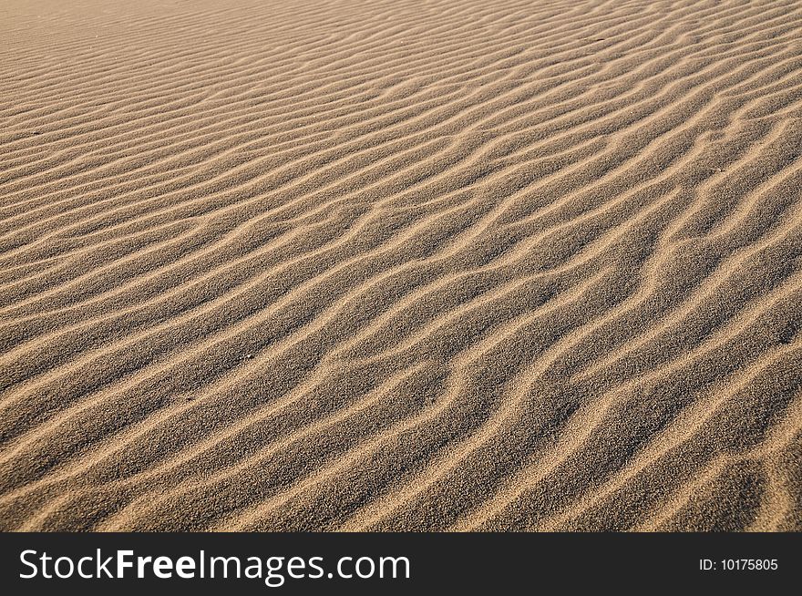Wavy texture of desert sand dunes in Death Valley. Wavy texture of desert sand dunes in Death Valley