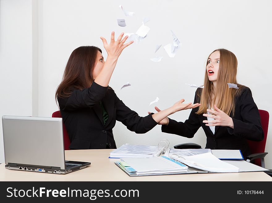 Business woman throws upwards the broken off document. Business woman throws upwards the broken off document