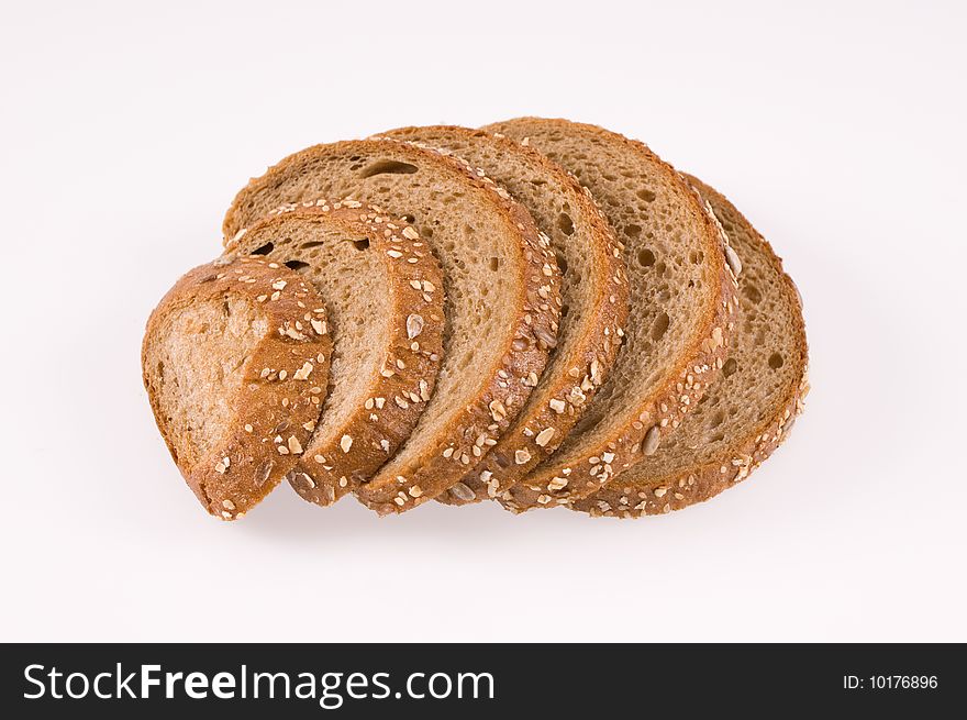 Slices of bread on white background