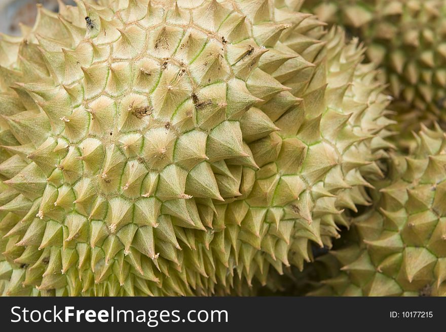 Fresh durian fruit at an outdoor market stall