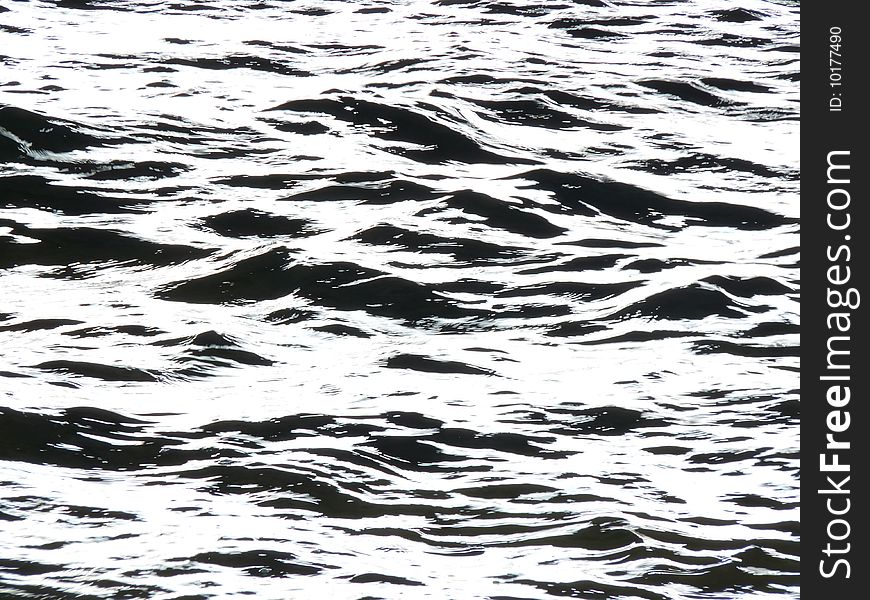 Overexposed surface of water near the bank of the river. It may be interpreted in many ways. Overexposed surface of water near the bank of the river. It may be interpreted in many ways.