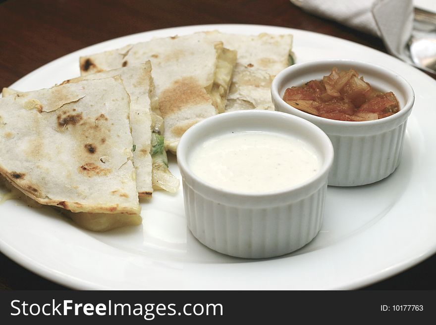 Cheese flavored pita bread with mayonnaise and tomato dressing