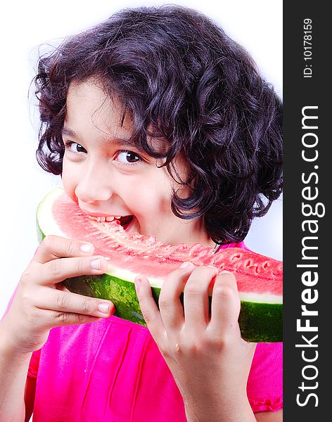 A beautiful girl eating water melon and smiling. A beautiful girl eating water melon and smiling