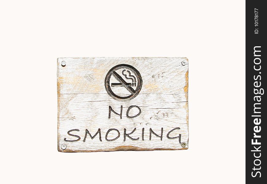 A No smoking board done in wood. A No smoking board done in wood.