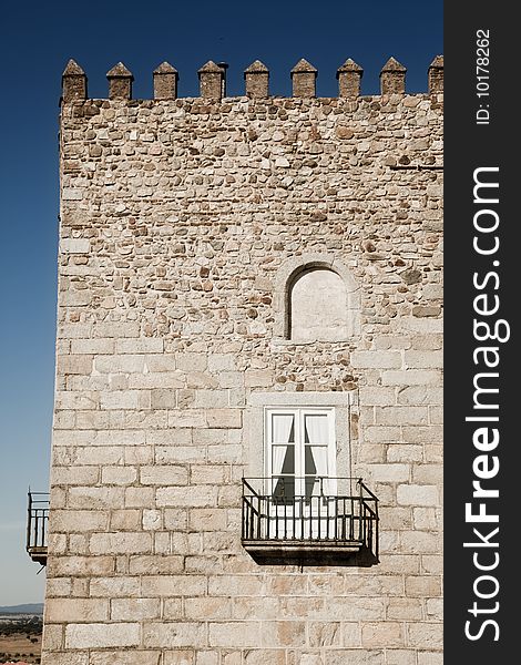 Medieval stone tower under Andalusian blue sky. Medieval stone tower under Andalusian blue sky.