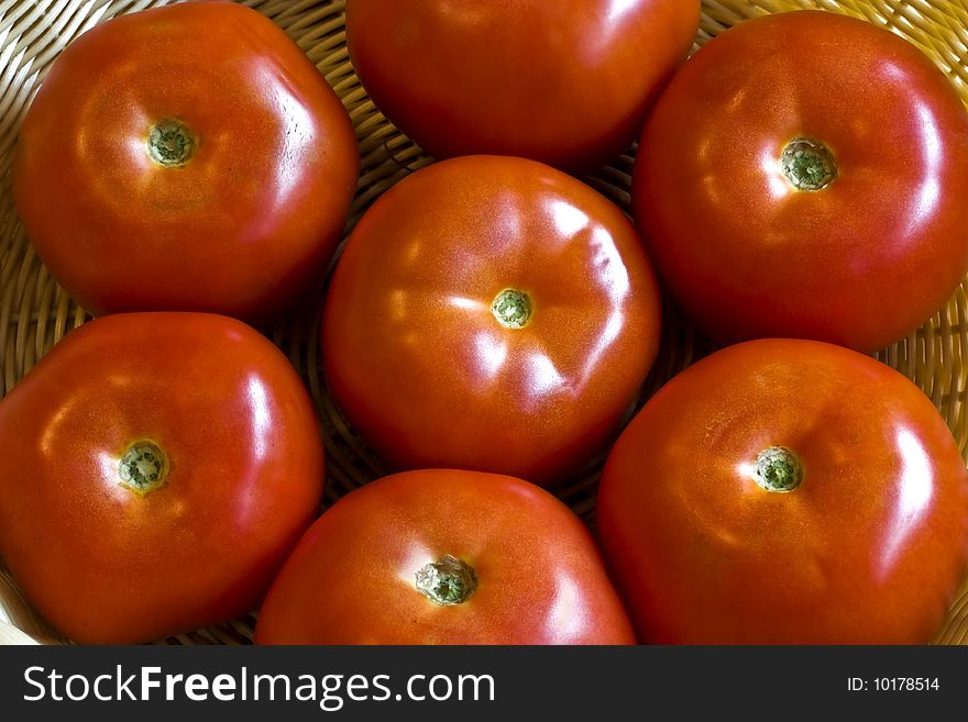 A close up of beef tomatoes in a flower pattern. A close up of beef tomatoes in a flower pattern