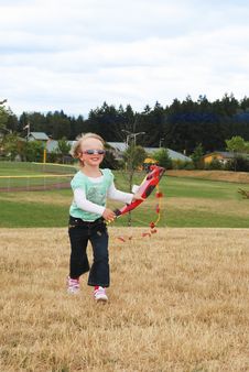 Smiling Kid Playing With Kite In The Park. Royalty Free Stock Photo