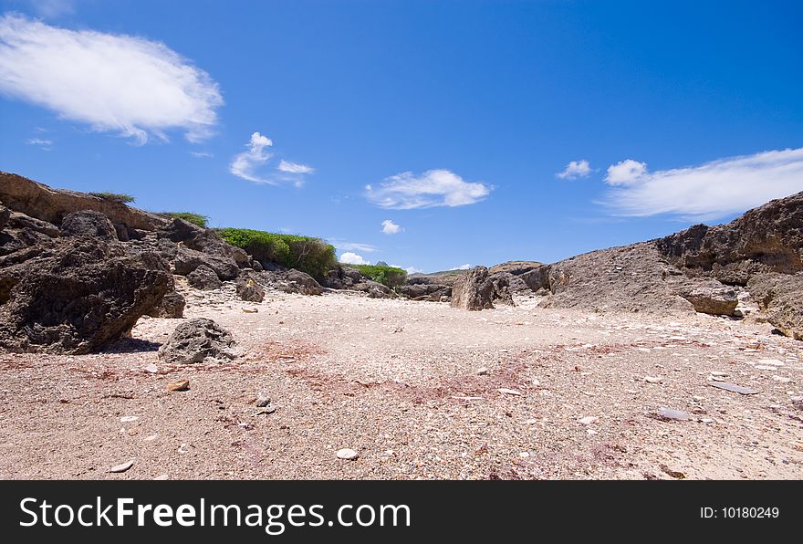 Rocky bay view with coral and stone beach. Rocky bay view with coral and stone beach