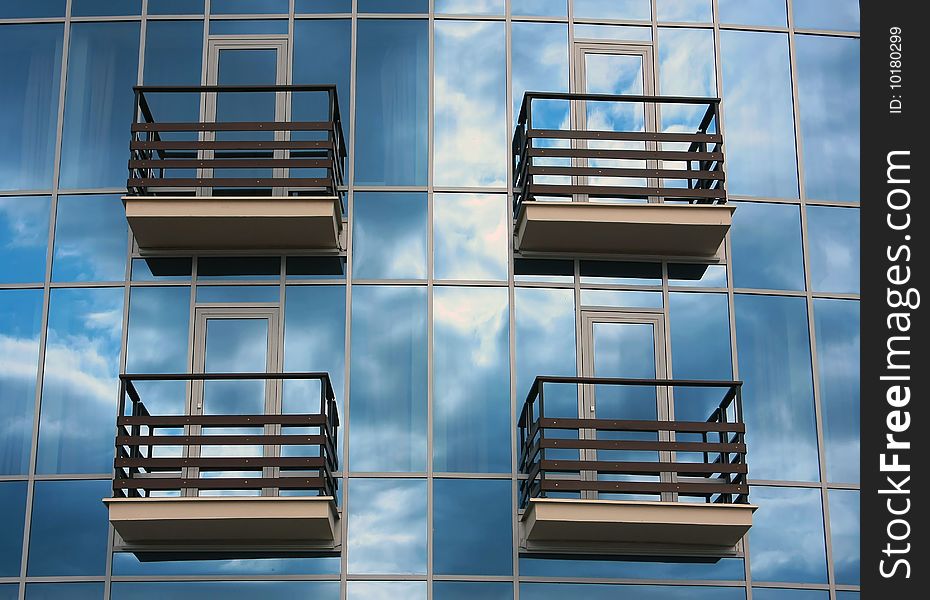 Fragment of a glass wall of small suburban modern hotel. Fragment of a glass wall of small suburban modern hotel