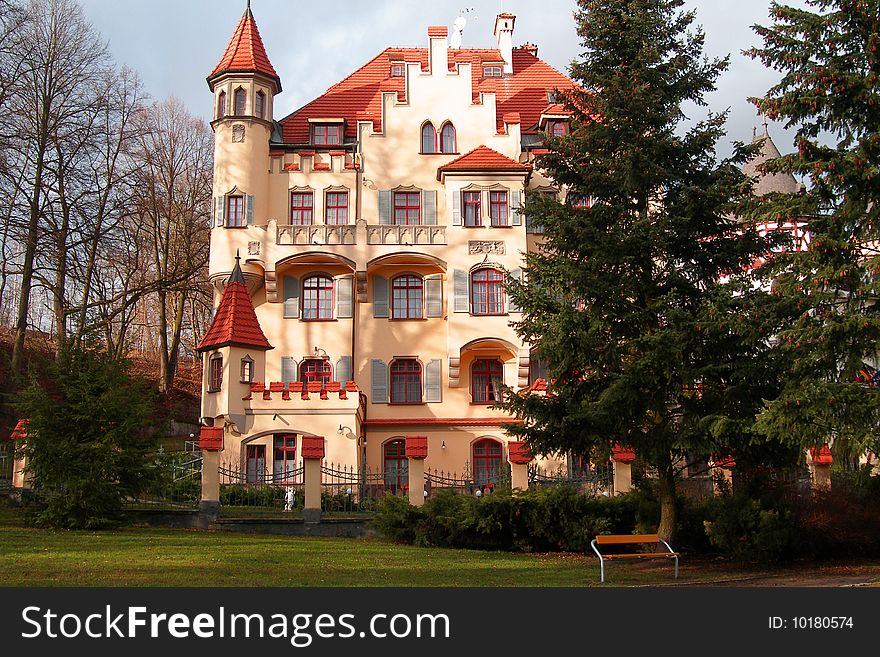 Beautiful building with a red tile roof and towers. City of Karlovy Vary, Czechia. Beautiful building with a red tile roof and towers. City of Karlovy Vary, Czechia.