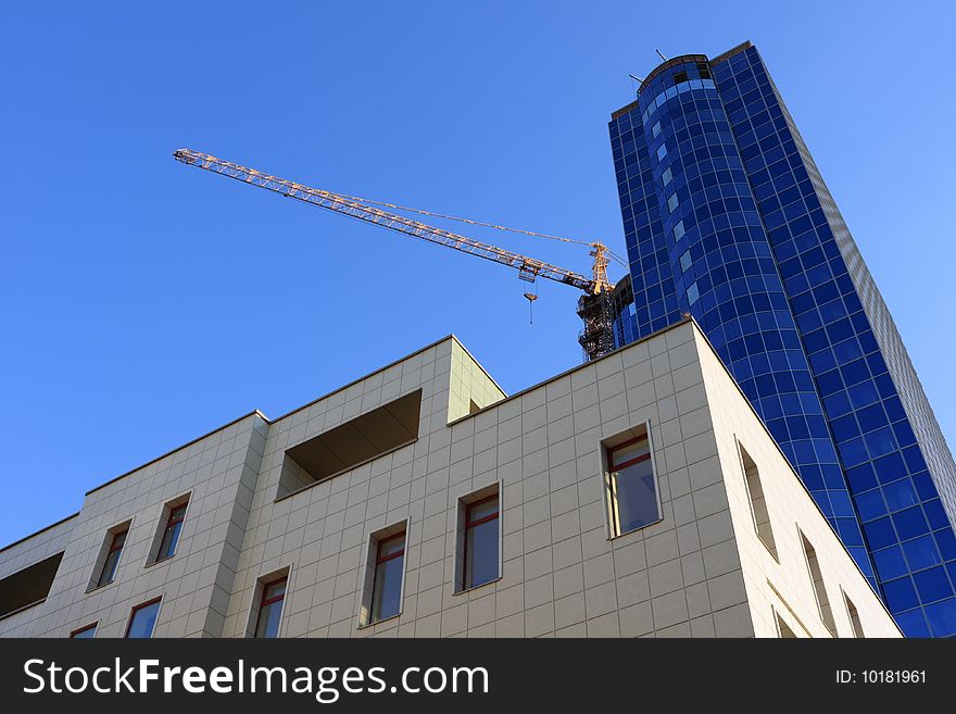 Building of modern office buildings against the dark blue sky