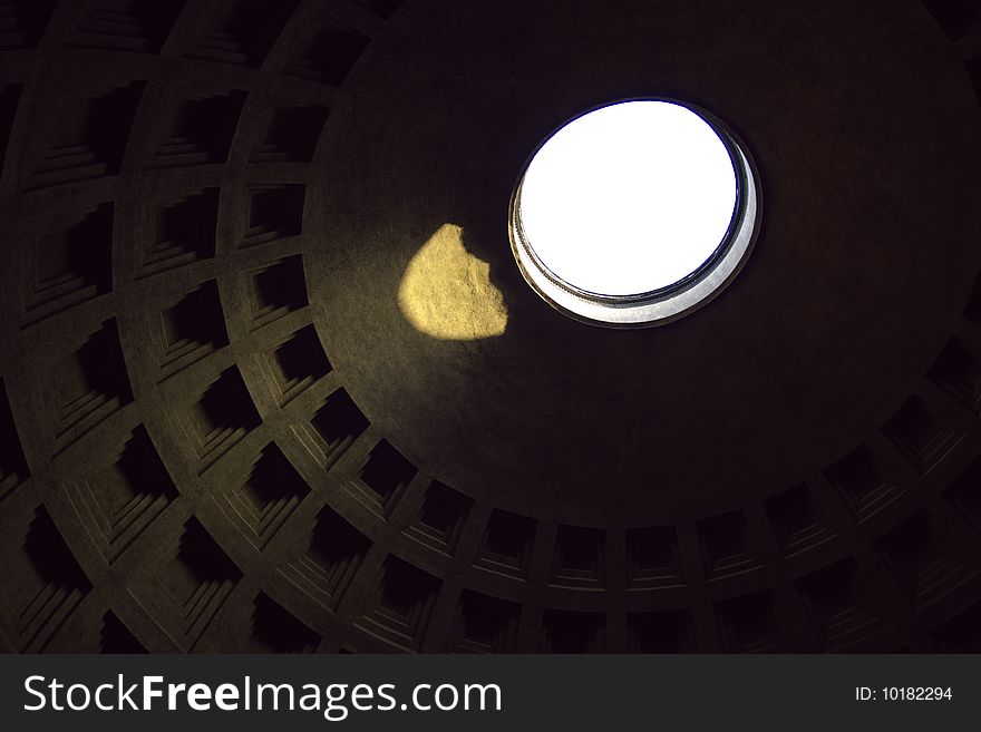 Interior of Pantheon dome with sun light coming from roof window. Rome, Italy, EU. Interior of Pantheon dome with sun light coming from roof window. Rome, Italy, EU