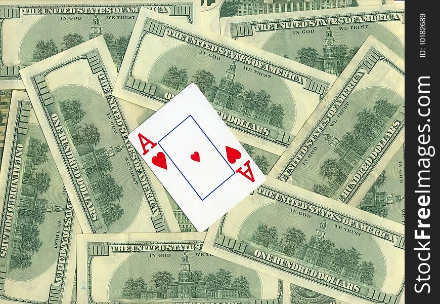 Background of money and playing cards isolated over white. Background of money and playing cards isolated over white