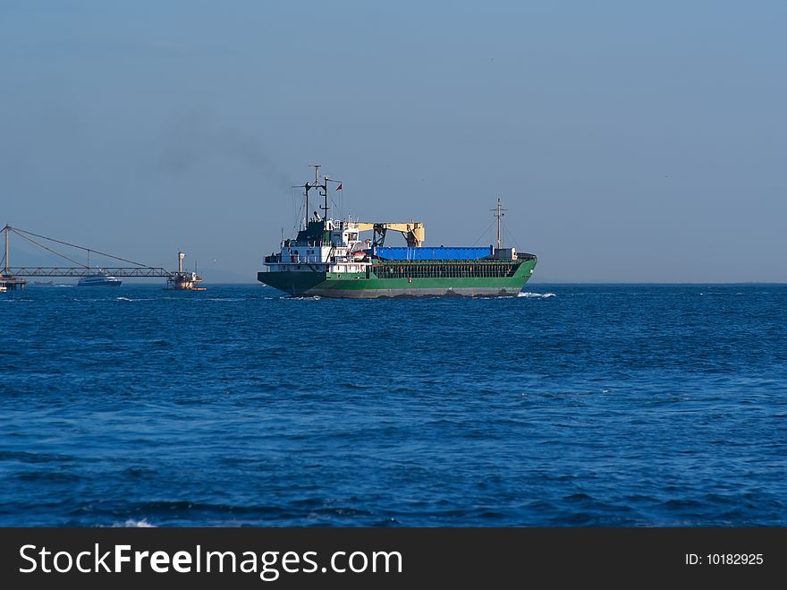 Cargo ship passing through Straits of Bhosporus. Istanbul. Turkey. Cargo ship passing through Straits of Bhosporus. Istanbul. Turkey