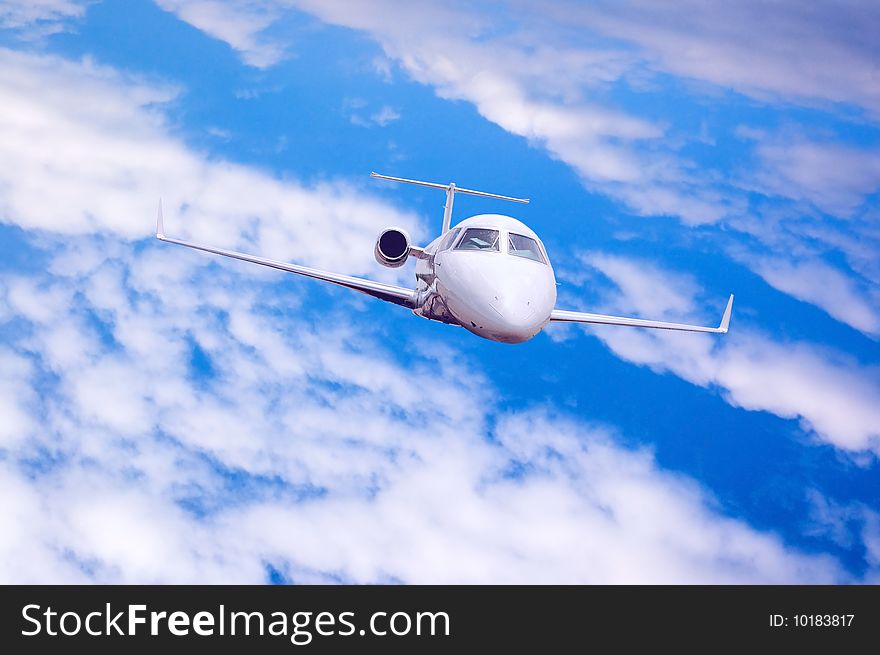 Airplane in air on blue sky