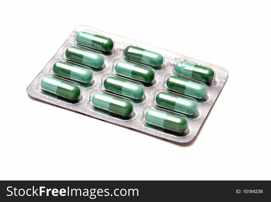 Green Capsules isolated onwhite background