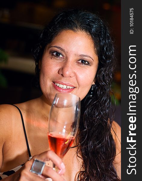Woman drinks a glass of Rosé wine. Woman drinks a glass of Rosé wine