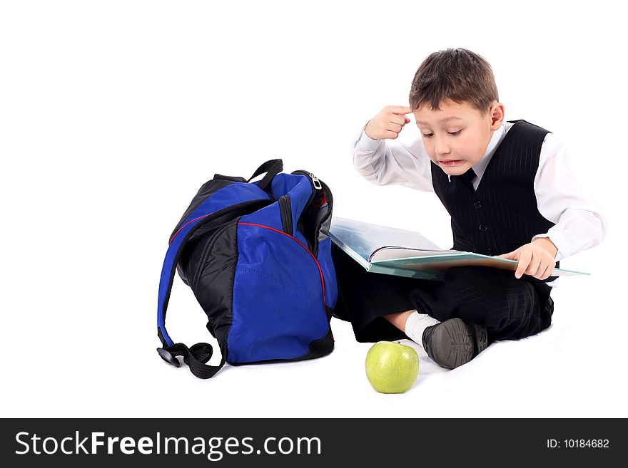 Schoolboy with book and apple