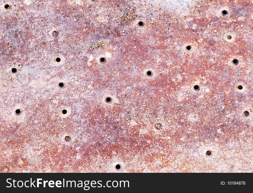 Strange grunge surface with holes.