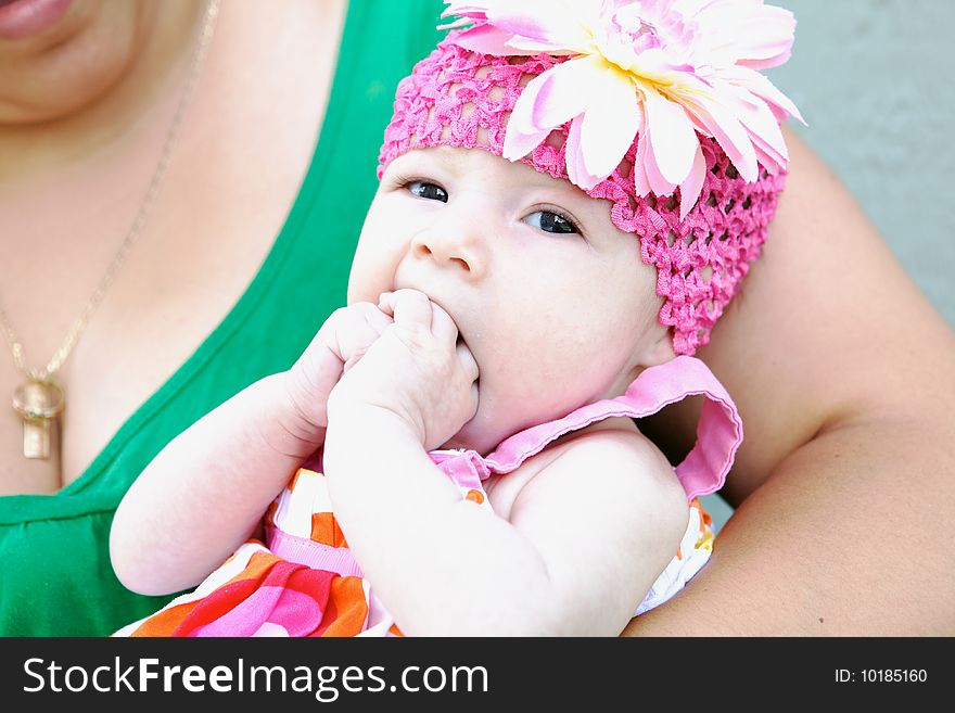 An adorable baby making a funny face at camera. An adorable baby making a funny face at camera