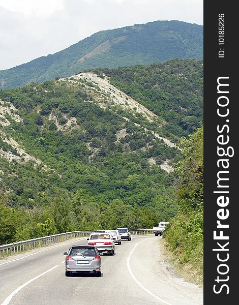 Cars drives along the mountain serpentine road