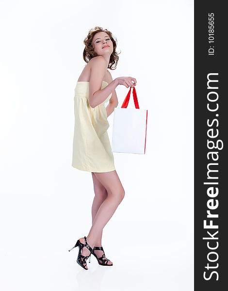 Young woman with shopping bag on isolated background. Young woman with shopping bag on isolated background