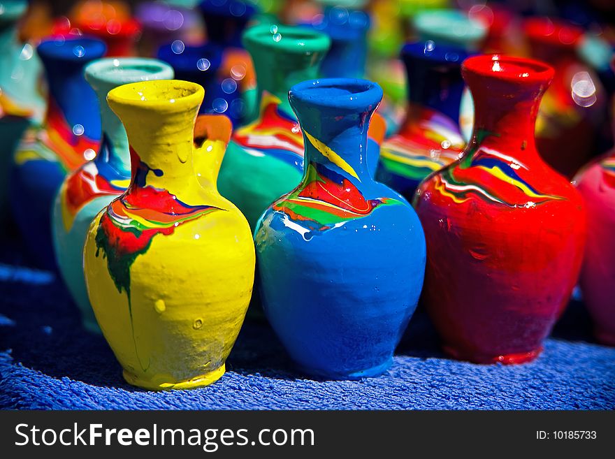 Colorful ceramic whistles, yellow, blue and red