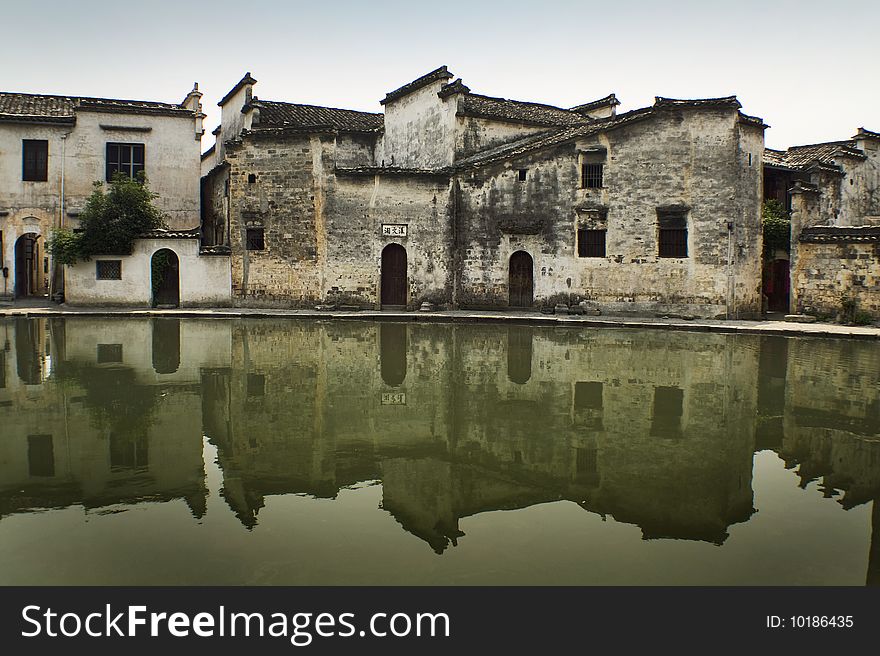 Ancient chinese buildings reflected on water