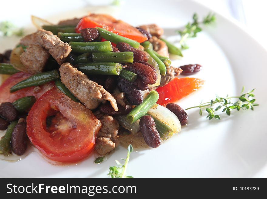 Vegetable salad with meat on a plate