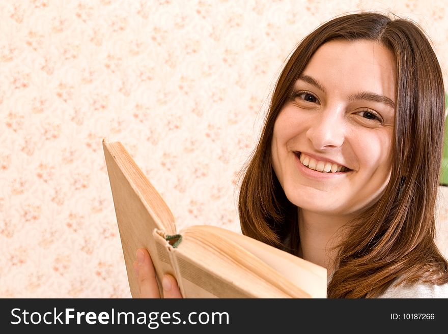 Young smiling student woman with a book. Young smiling student woman with a book