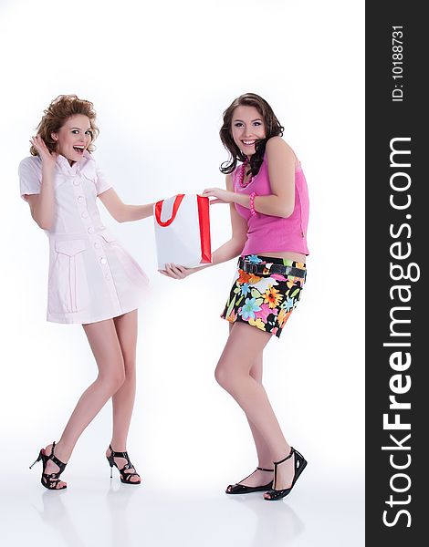 Young woman with shopping bag speaking and laughing. Young woman with shopping bag speaking and laughing