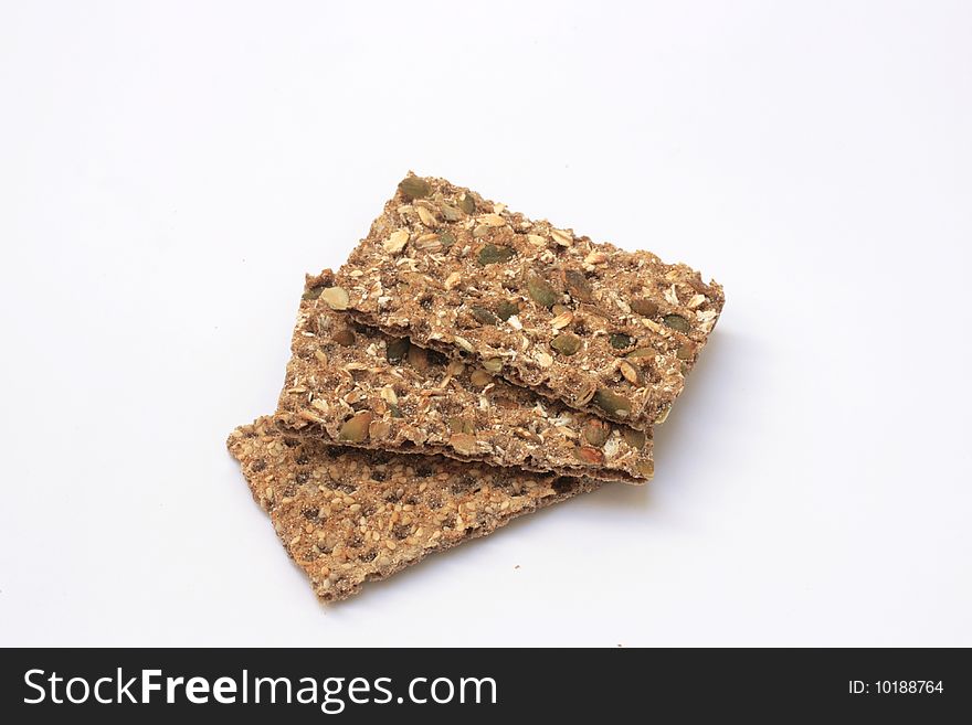 Three wholesome fibre crackers on an isolated white background