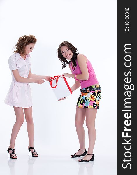 Young attractive woman with shopping bag smiling. Young attractive woman with shopping bag smiling