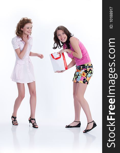 Young woman with shopping bag laughing. Young woman with shopping bag laughing