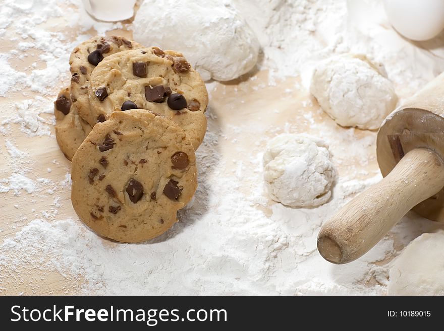 Freshly made cookies on a table with a lot of flour