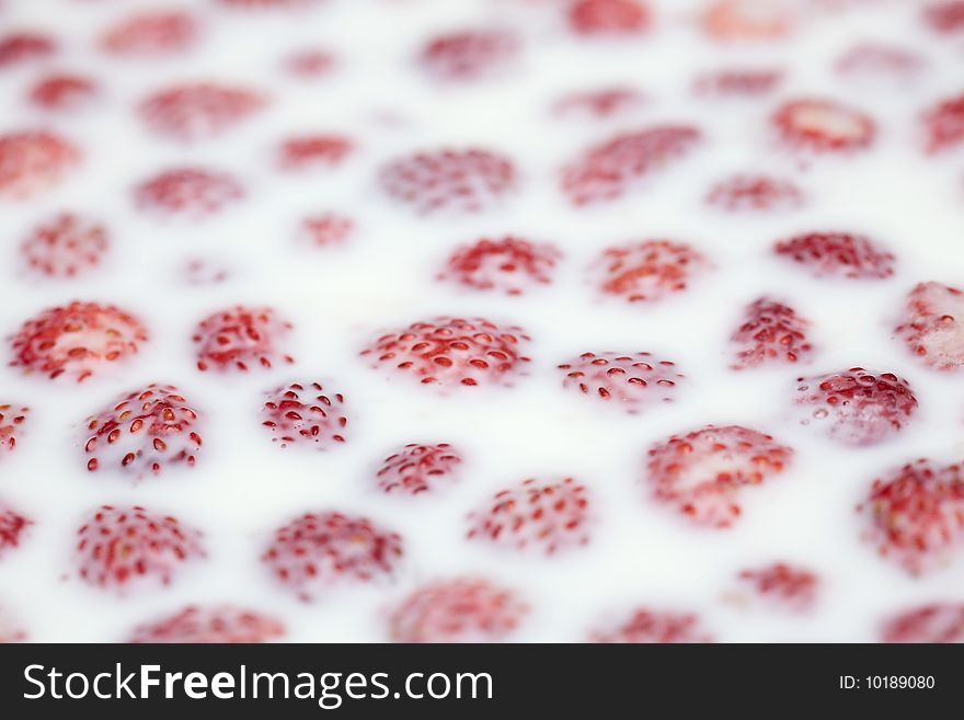 Strawberry in milk, close up