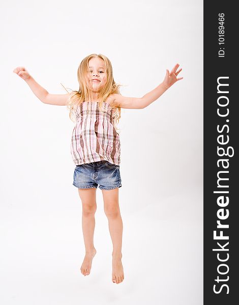 Beautiful little girl jump with long blonde hair