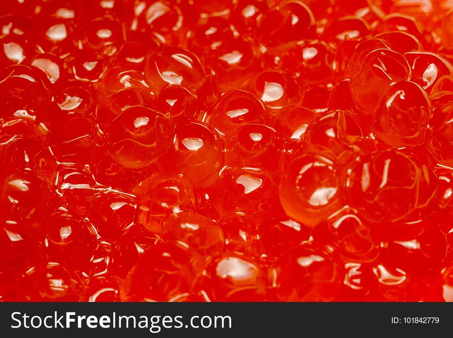 Fresh and tasty red salmon caviar close up background. Fresh and tasty red salmon caviar close up background.