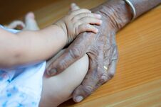 Hand Baby On Hand Elderly Lady Stock Images