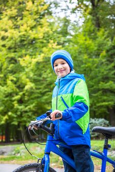 Kid Boy Outdoor With Bike. Royalty Free Stock Photography